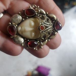 Sterling silver carved bovine bone and garnet pend